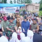 bupati-dharmasraya-dan-tni-resmikan-jembatan-aramco-lubuk-karak