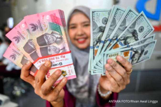 Grafik pergerakan nilai tukar mata uang Rupiah terhadap Dolar AS di layar monitor