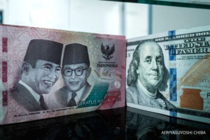 Grafik pergerakan mata uang rupiah yang melemah terhadap dolar Amerika Serikat di pasar spot.