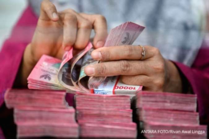 Ilustrasi mata uang rupiah Indonesia dengan latar belakang simbol dolar Amerika Serikat