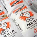Logo PT Japfa Comfeed Indonesia Tbk terpampang di papan bursa efek