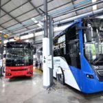 Logo PT VKTR Teknologi Mobilitas Tbk dengan latar belakang biru elektrik